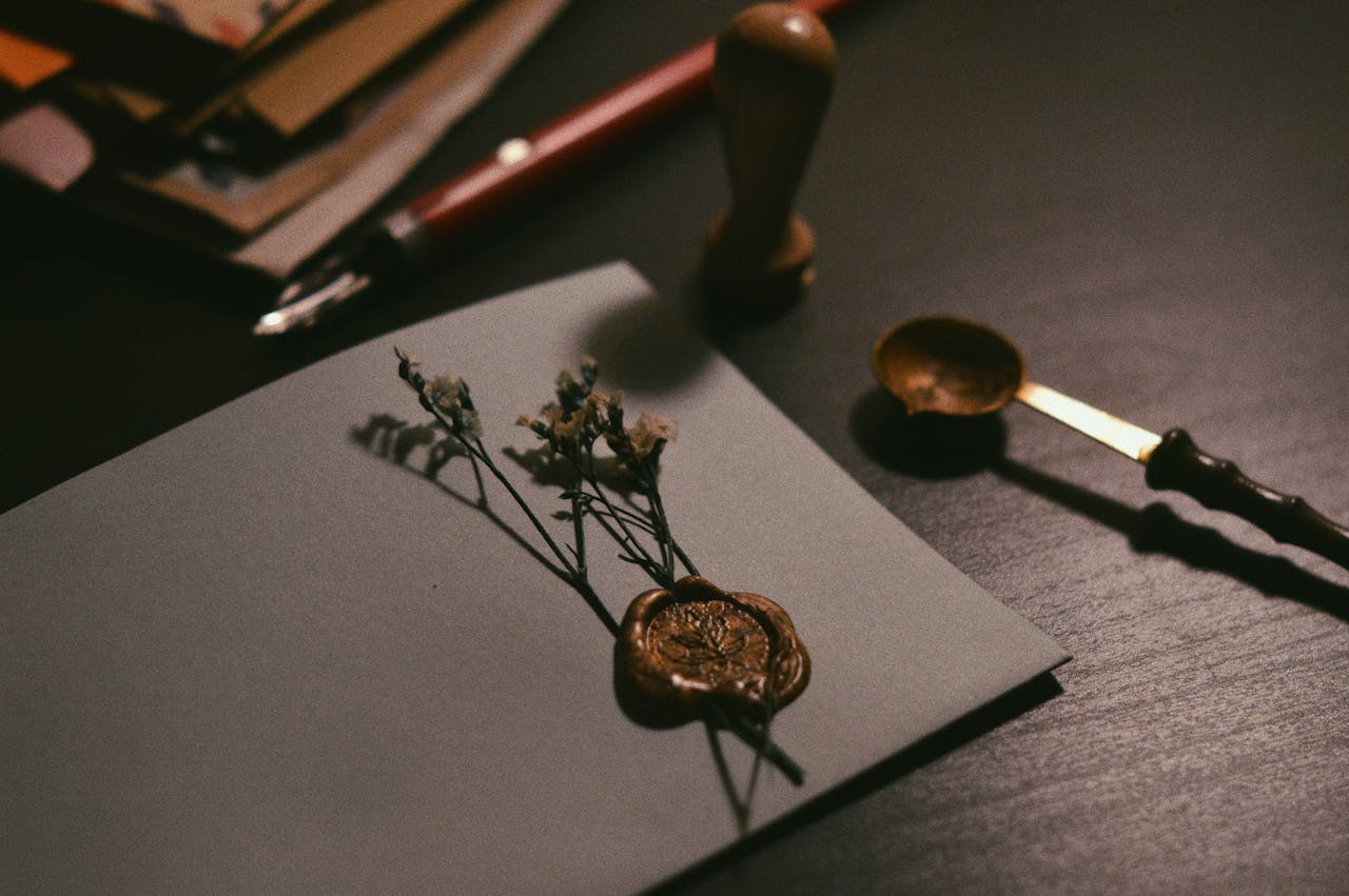services-01 A vintage letter with wax seal and flowers on a desk, evoking nostalgia.